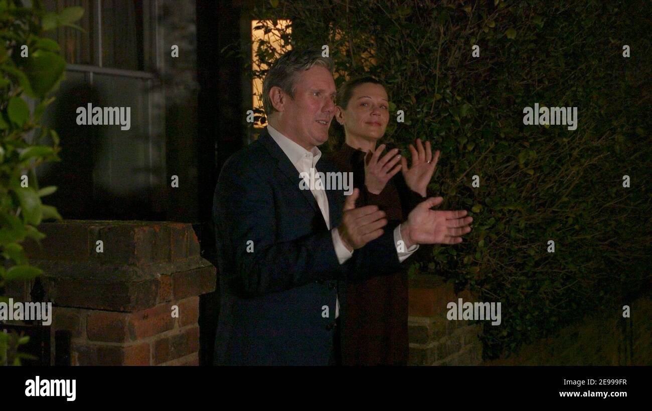 Screengrab taken from PA Video of Labour leader Sir Keir Starmer and his wife Victoria outside their London home as they join in with a nationwide clap in honour of the 100-year-old charity fundraiser who died on Tuesday after testing positive for Covid-19. Picture date: Wednesday February 3, 2021. Stock Photo