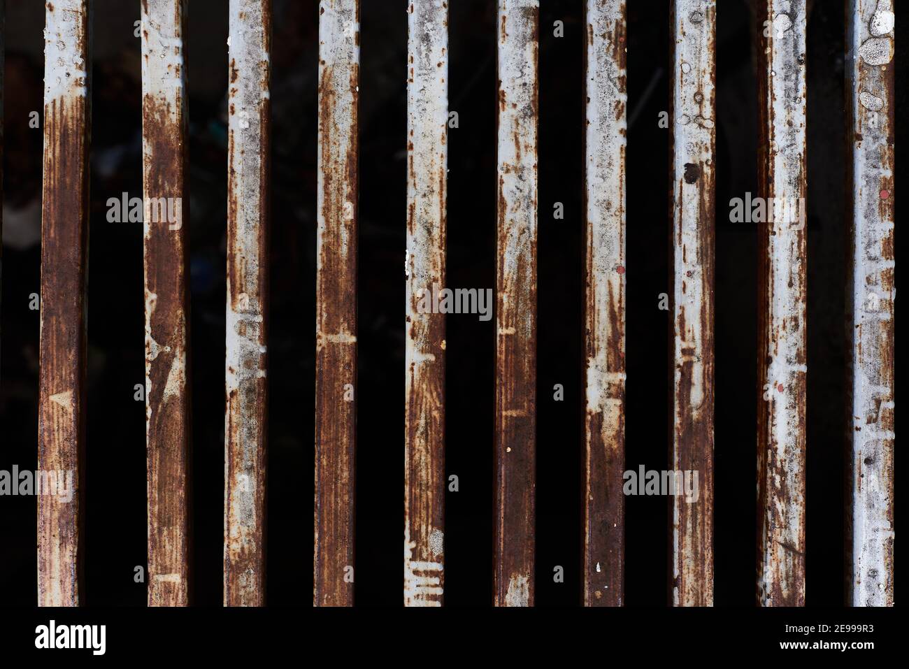 Rusty metal rods isolated on black background poverty prison age retro ...