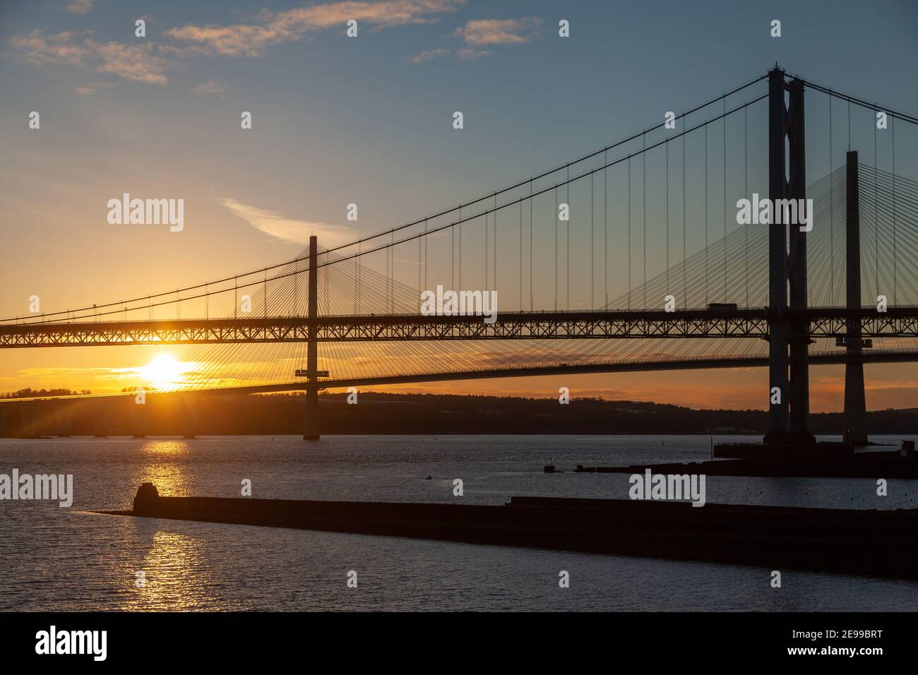The Forth Road Bridge and Queensferry Crossing at sunset North Queensferry near Edinburgh Scotland. Stock Photo