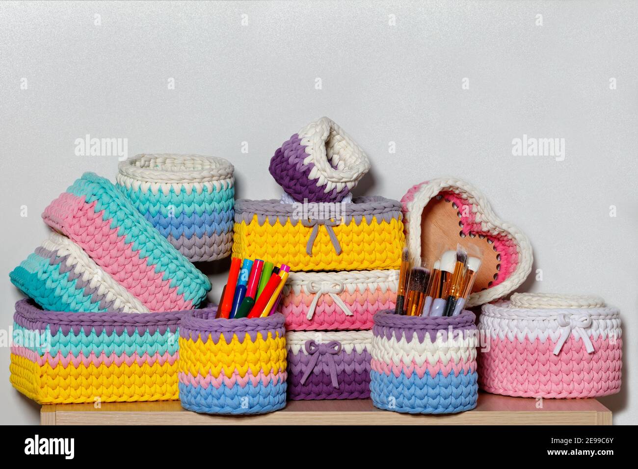 Multi-colored wicker textile baskets of rectangular and round shape for  storing women's cosmetics and jewelry, close-up, copy space Stock Photo -  Alamy