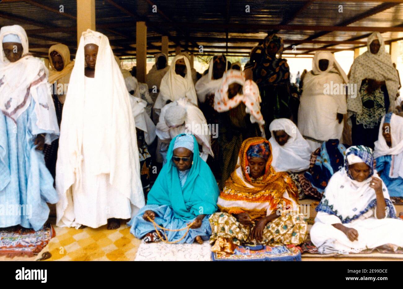 Niger Women Praying with Prayer Beads Stock Photo
