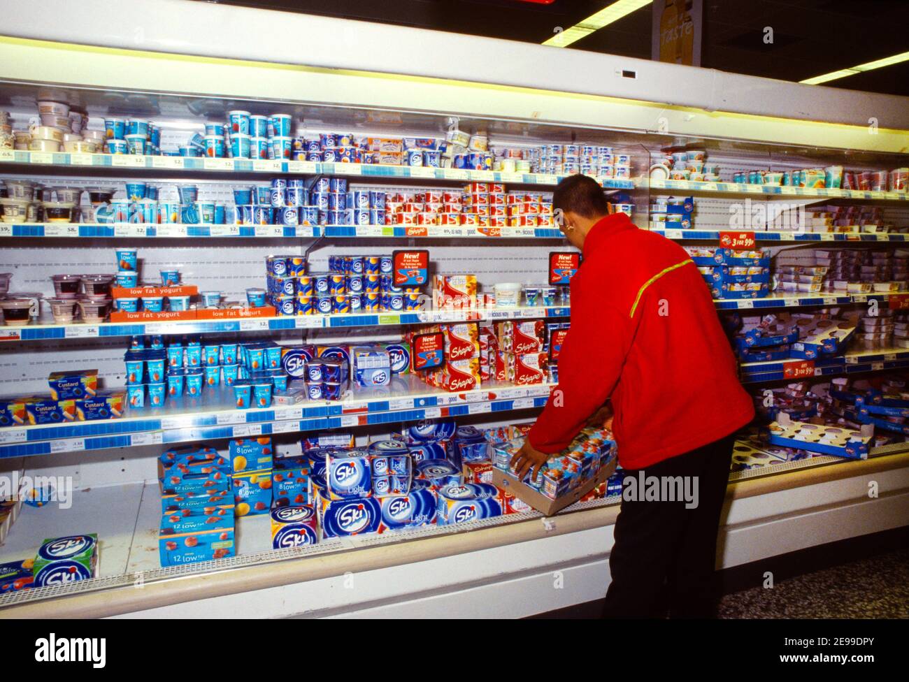 Stacking shelves supermarket worker hires stock photography and images
