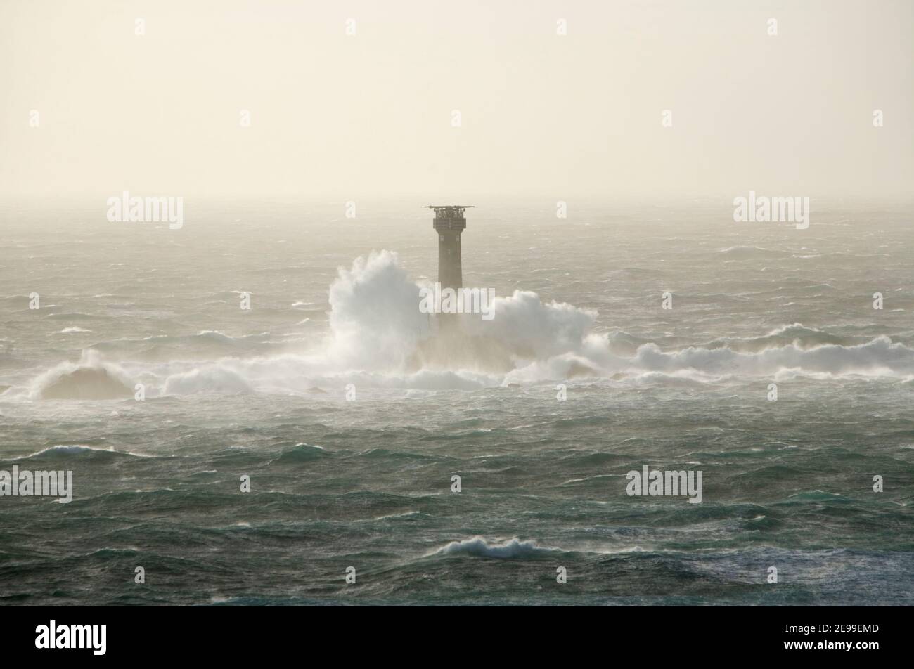 Waves Crashing against Longships Lighthouse in Stormy Seas. Cornwall. England. UK. Stock Photo