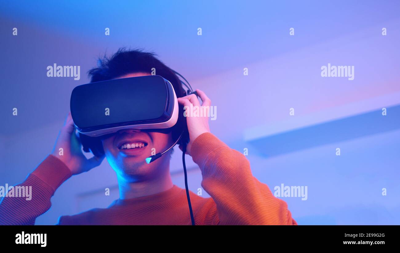 young man surprised by something in virtual reality. High quality photo Stock Photo