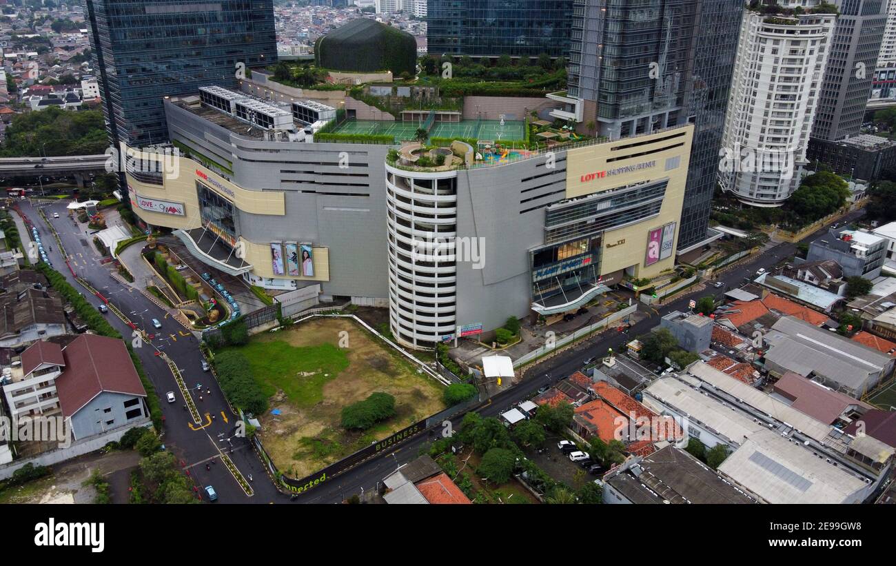 Aerial view of Lotte Shopping Avenue building in Jakarta and noise cloud with cityscape. the