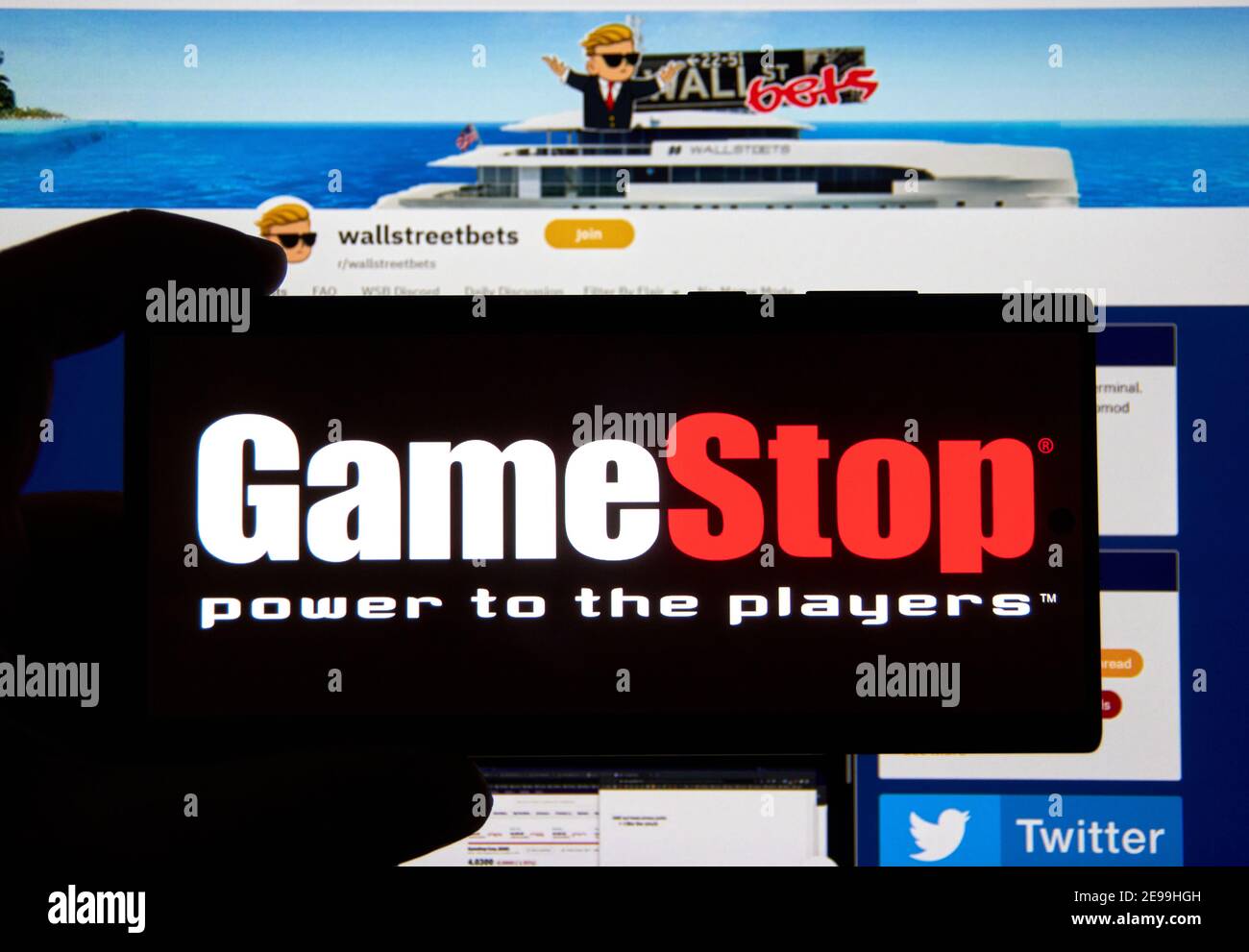 Montreal, Canada - February 3, 2021: Gamestop logo over wallstreetbets subreddit webpage. It is an American video game, consumer electronics, and reta Stock Photo
