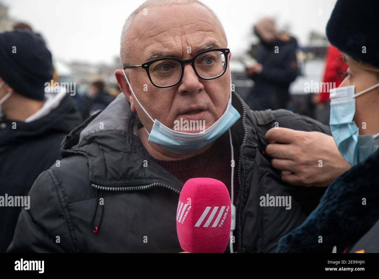 Moscow, Russia. 23rd of January, 2021 Journalist of the Rain TV Channel Pavel Lobkov interviews participants of an unsanctioned rally in support of Russian opposition leader Alexei Navalny at Pushkinskaya square in the center of Moscow city, Russia Stock Photo