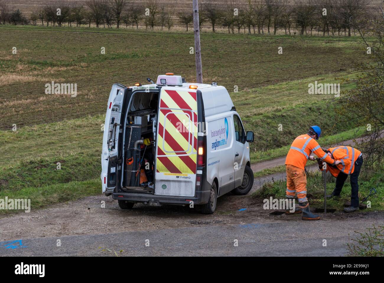 Engineers from Anglian Water investigate a water main in a rural Norfolk location. Stock Photo