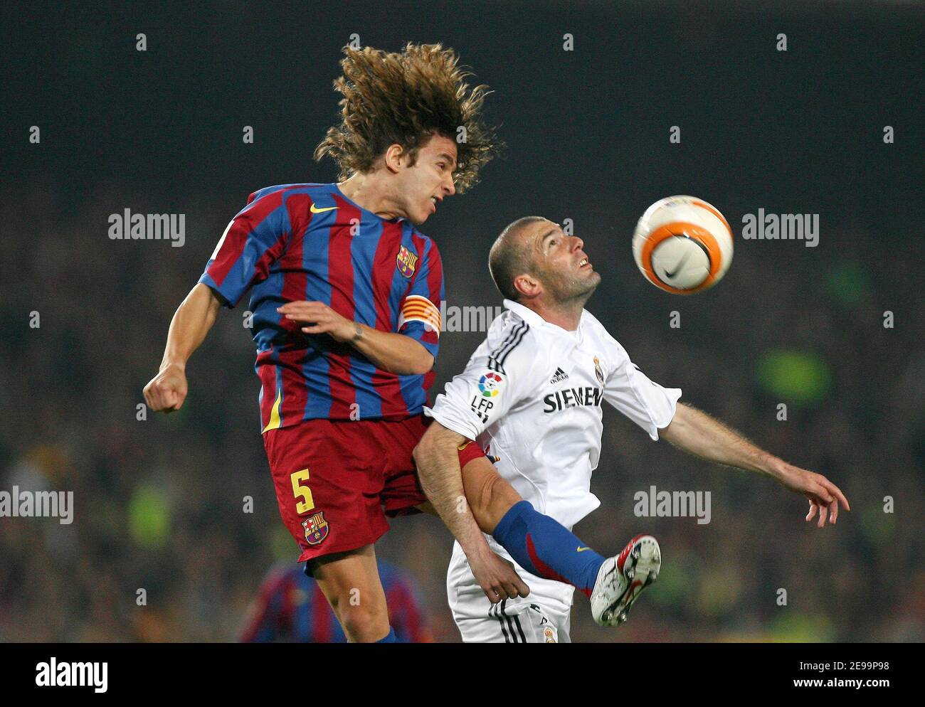 Real Madrid's Zinedine Zidane and Barcelona's Carles Puyol during the Spanish primera league, FC Barcelona vs Real Madrid, at the Nou Camp Stadium, in Barcelona, Spain, on April 1, 2006. The game ended in a draw 1-1. Photo by Christian Liewig/ABACAPRESS.COM Stock Photo
