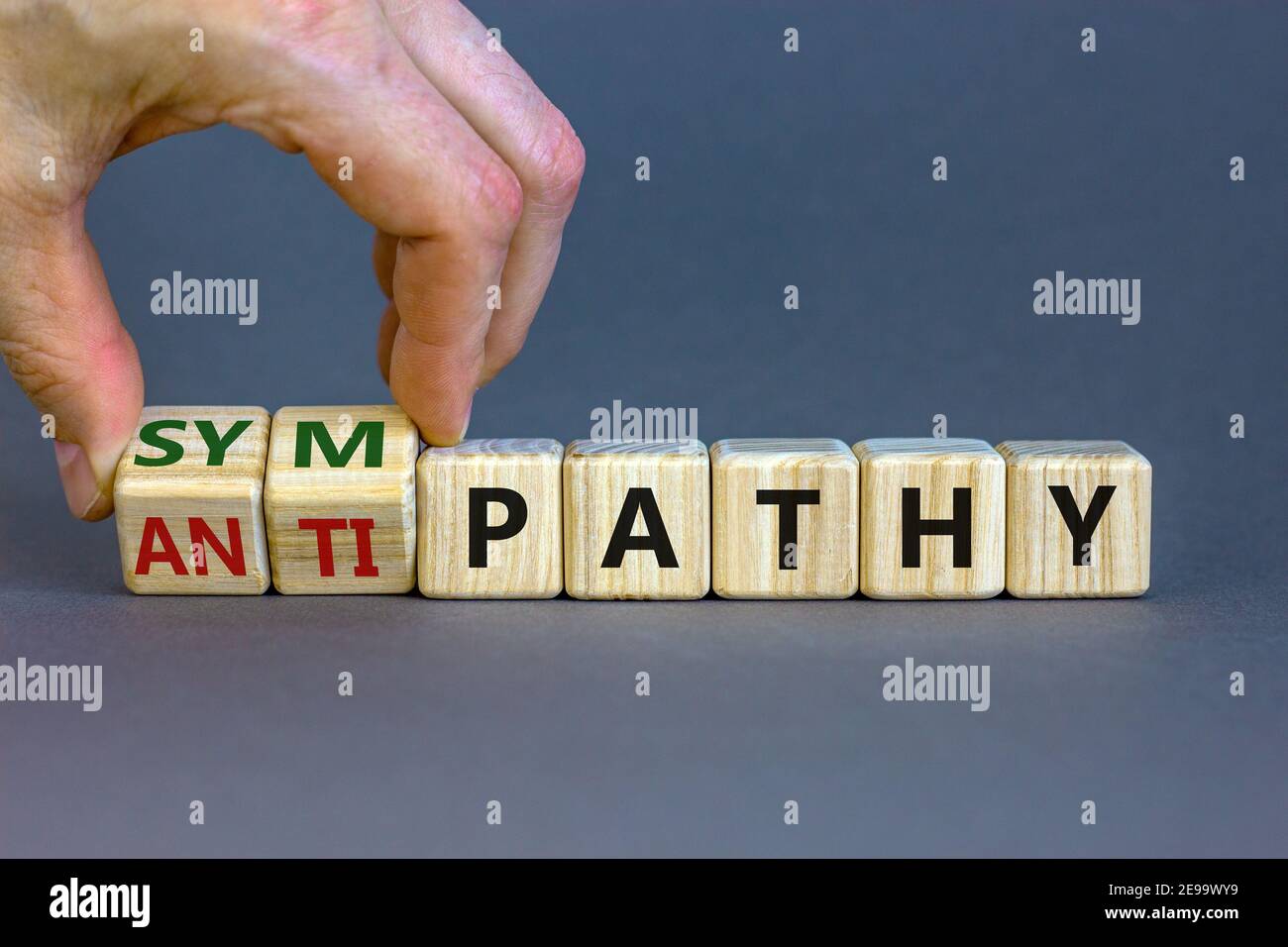 Antipathy Example Image From antipathy to sympathy. Businessman turns cubes and changes the ...