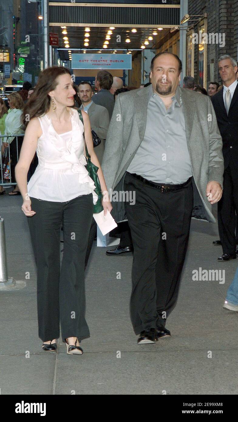 James Gandolfini arrives with an unidentified guest at the opening