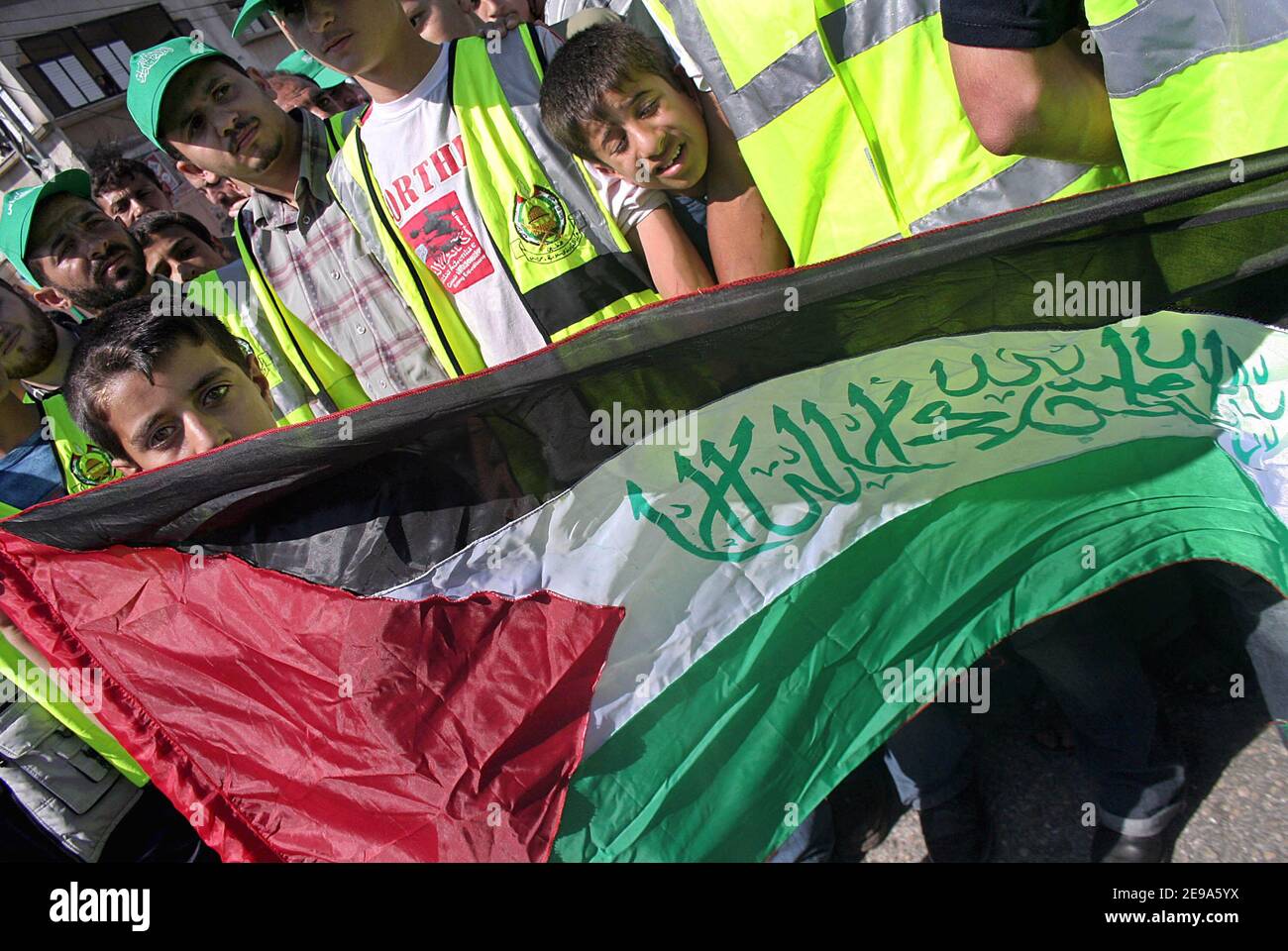 Supporters of the Islamic Hamas movement attend a rally in support of the Hamas-led Palestinian government in Gaza City Friday May 5, 2006. Thousands of Palestinians marched Friday throughout the West Bank and Gaza Strip in support of the beleaguered Hamas-led government, which has been largely unable to function because of an economic boycott by the West. Photo by Mohamed Atta/ABACAPRESS.COM Stock Photo