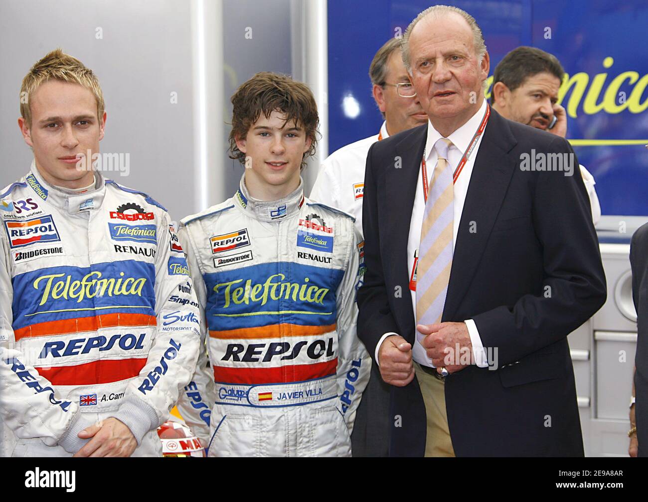 King Juan Carlos of Spain poses with Spanish GP2 team drivers Adam Carroll and Javier Sola during his visit to the Spanish Formula 1 Grand Prix held on the Catalunya track near Barcelona, Spain on May 14, 2006. Photo by Patrick Bernard/ABACAPRESS.COM Stock Photo