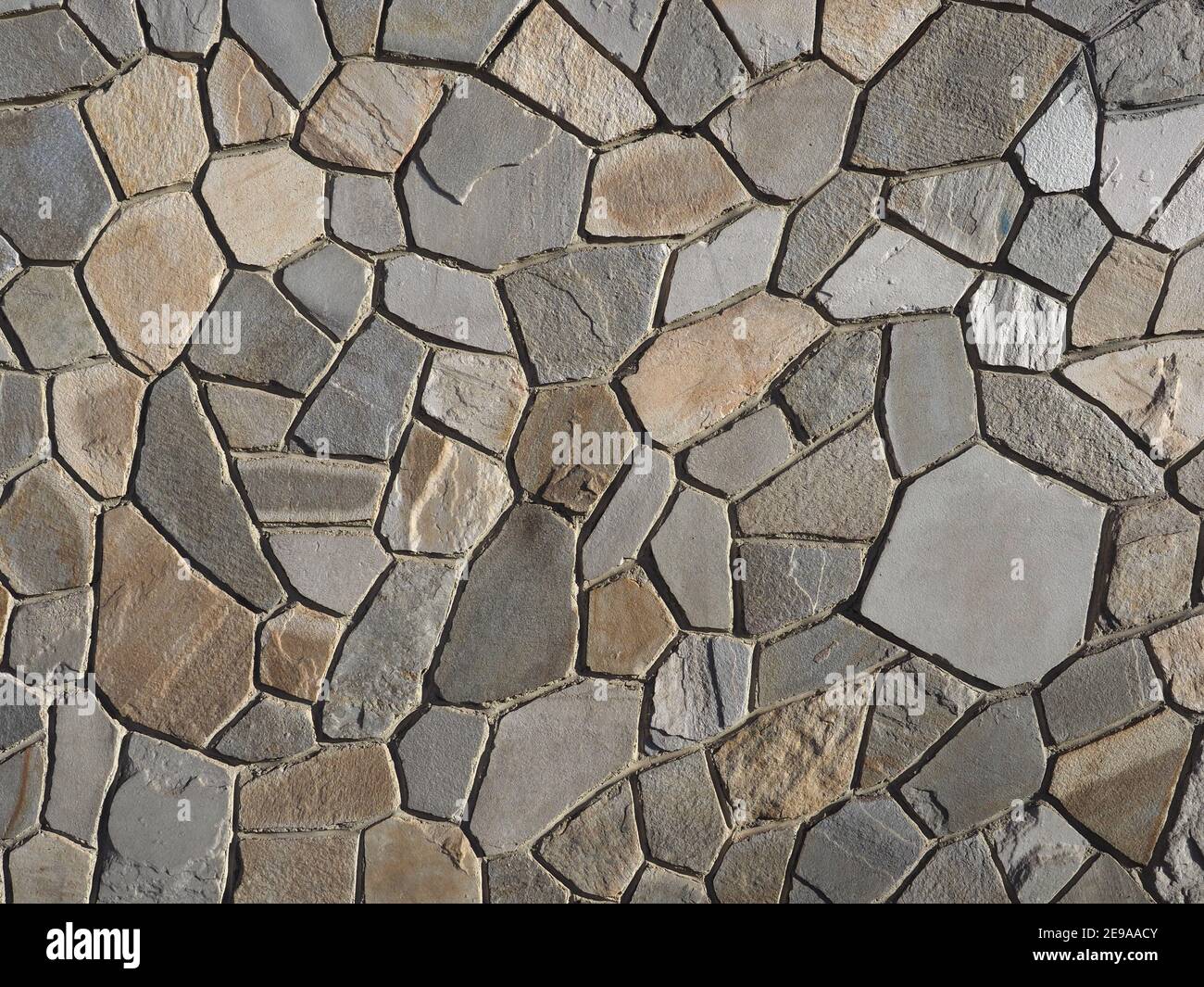 grey stone wall useful as a background Stock Photo - Alamy