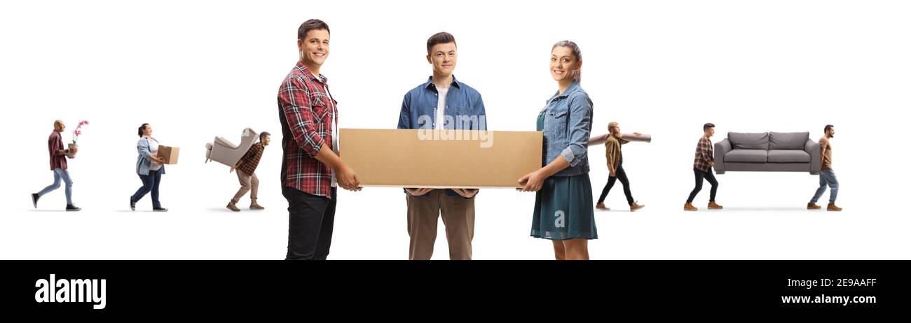 Young people carrying a cardboard box together and other people moving household items isolated on white background Stock Photo