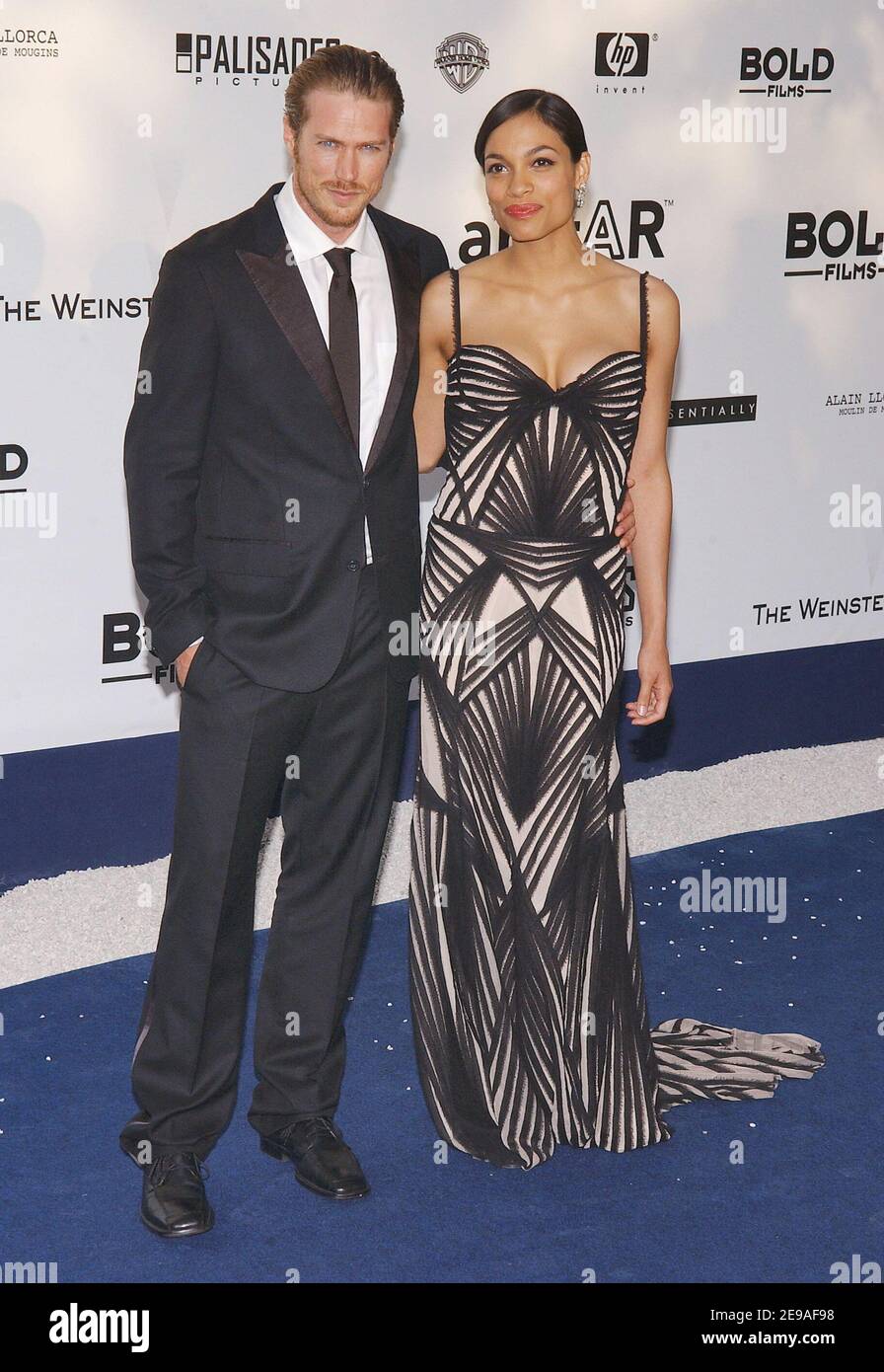 US actress Rosario Dawson and her boyfriend Jason Lewis upon arrival at