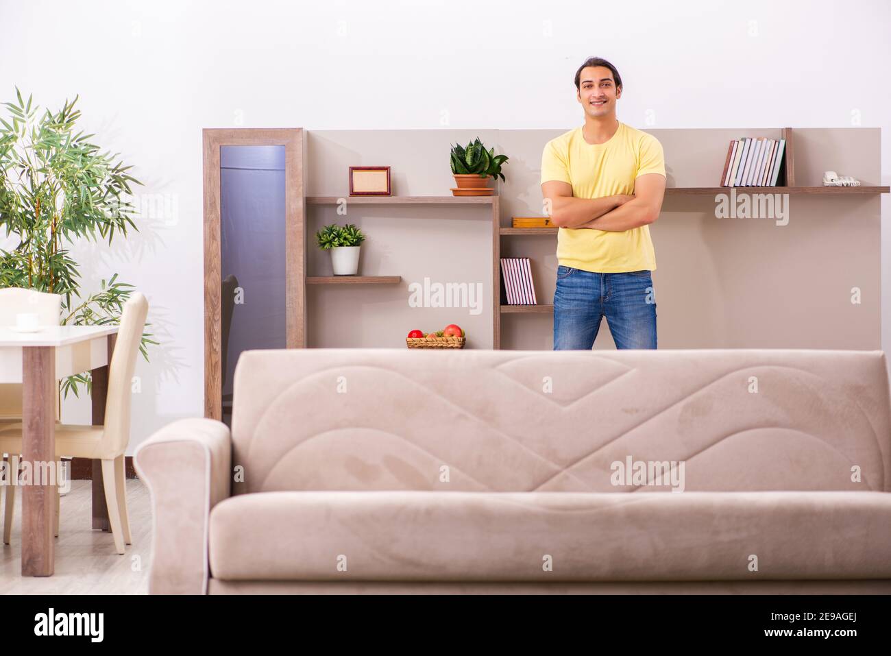 Young student boring at home during pandemic Stock Photo