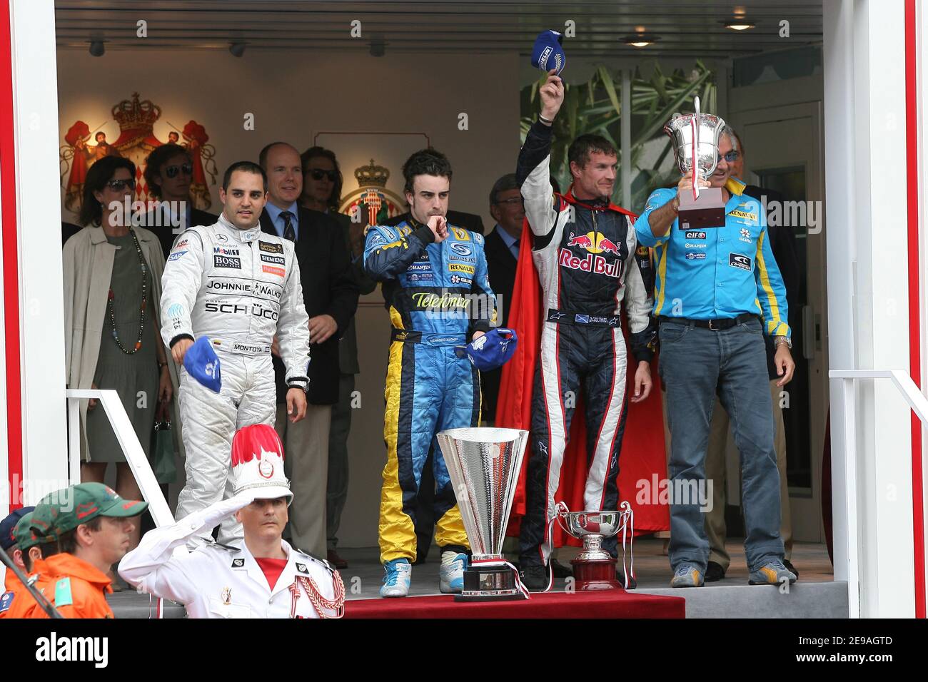 Colombian driver Juan Pablo Montoya, Spanish driver Fernando Alonso, Scottish driver David Coulthard and Renault F1 team director Flavio Briatore (l to r) stand in front of the Monaco Royal family at the end of the 2006 Formula 1 Grand Prix in Monaco on May 28, 2006. Pool photo by ABACAPRESS.COM Stock Photo