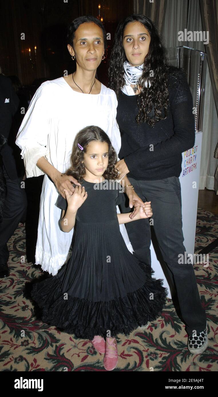 Karine Sylla with her two daughter Roxanne and Iman attend the auction to the benefit of 'Reves' associationheld at the Bristol Hotel, in Paris, France, on May 30, 2006. Bags designed by Celine and decorated by children's stars like Madonna, Kristin Scott Thomas or Carla Bruni. Photo by Bruno Klein/ABACAPRESS.COM Stock Photo