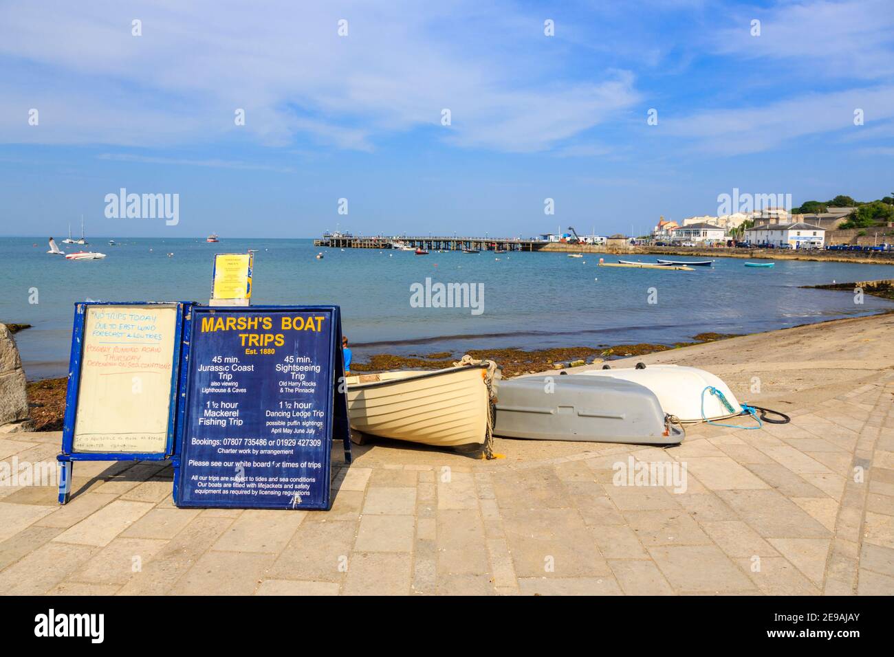 Sign for boat trips and excursions in Swanage Bay, Swanage, and view of  Swanage Pier, Isle of Purbeck on the Jurassic Coast, Dorset, southwest  England Stock Photo - Alamy