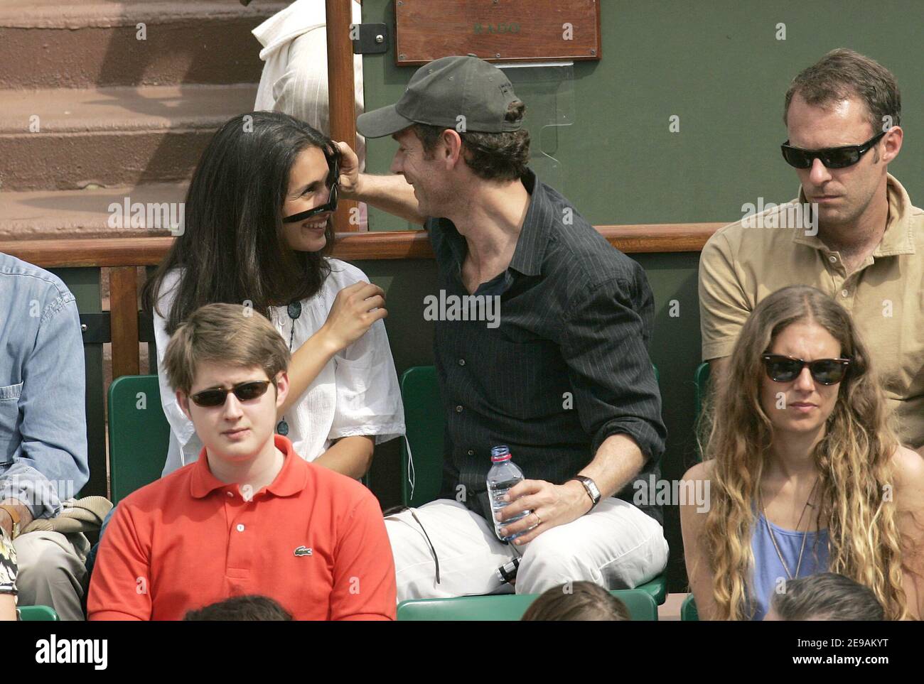 French actor Stephane Freiss and his wife Ursula watch a game during the  7th day of French Open Tennis tournament held at Roland Garros stadium in  Paris, France on June 4, 2006.