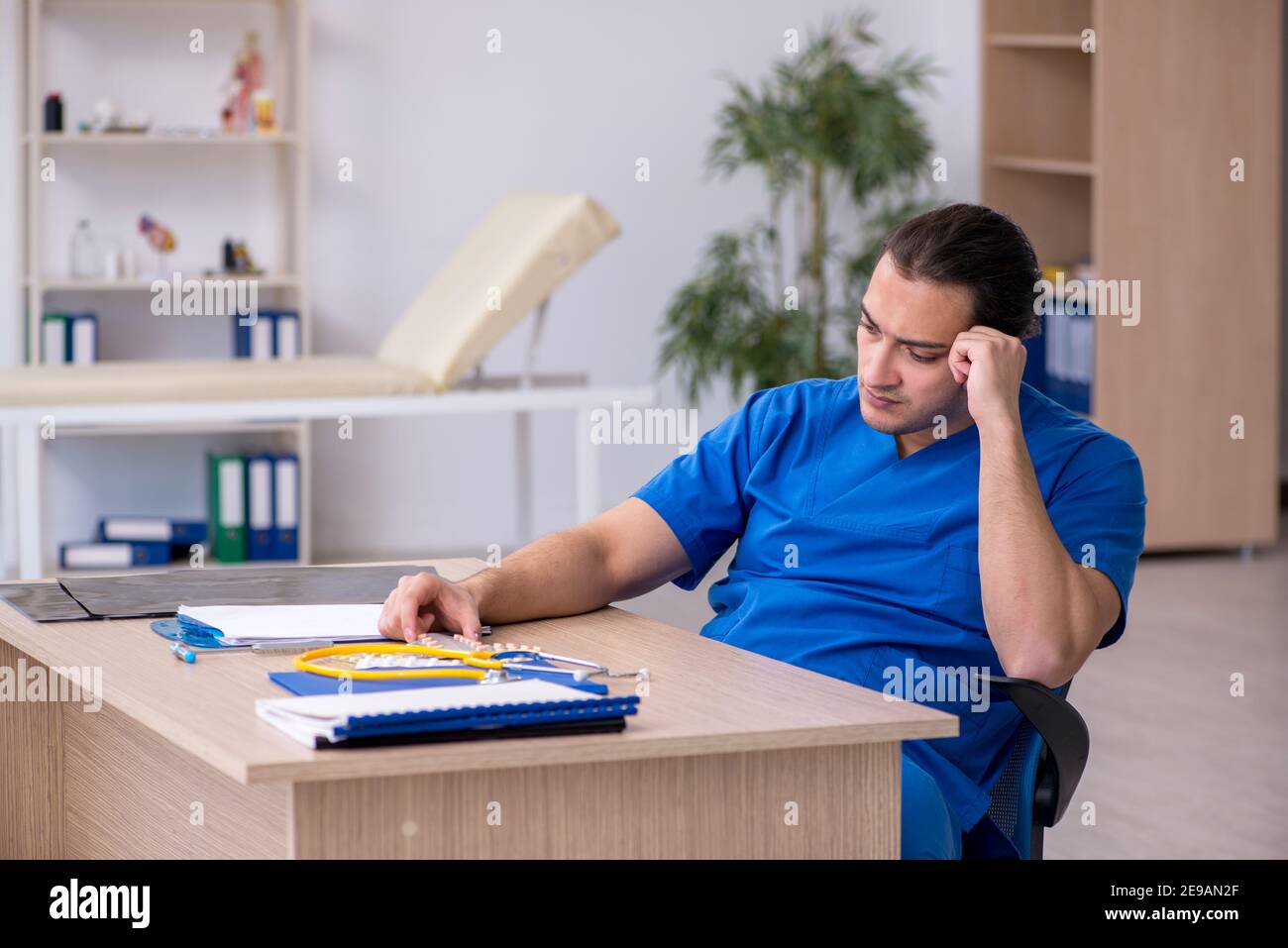 Young sick doctor being unhappy after night shift Stock Photo Alamy