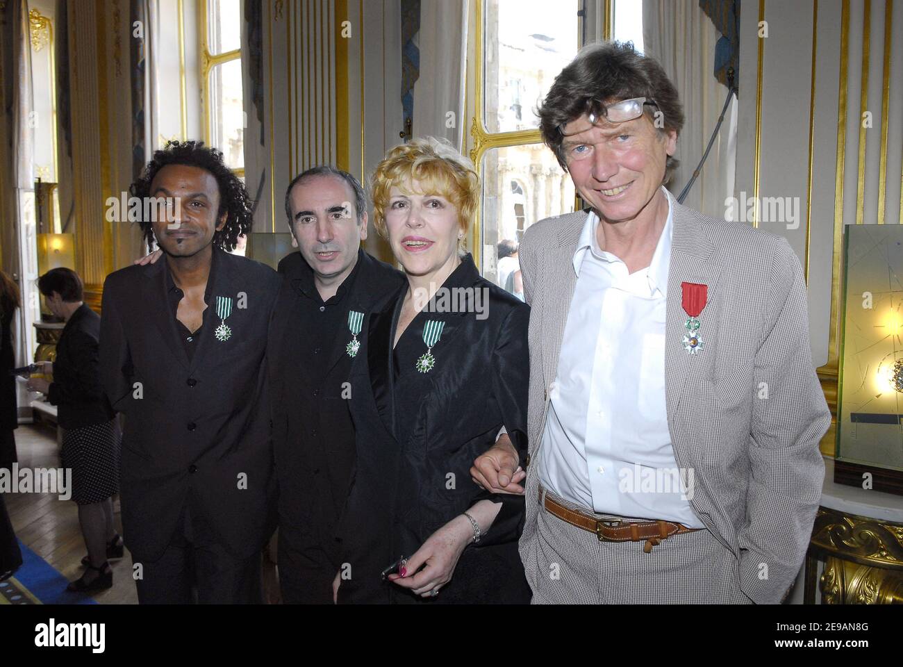 French musician Manu Katche, Director and actor Philippe Harel, French  humorist Sylvie Joly and French film director Etienne Chatilliez, pose  after being decorated with Legion of Honor by French culture minister Renaud