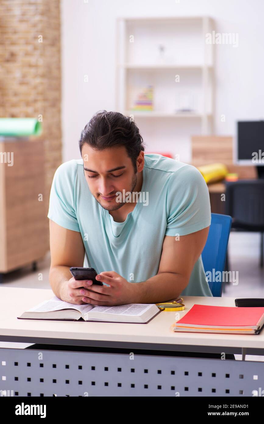 Young student preparing for exam at home Stock Photo - Alamy