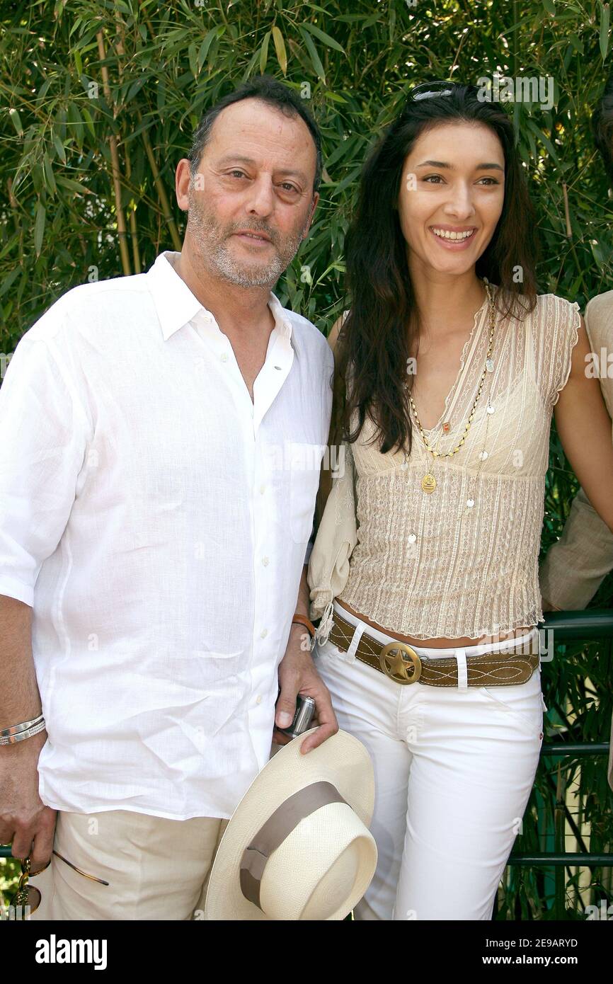 French actor Jean Reno with his wife Zofia Borucka arrive in the 'Village',  the VIP quarter of the French Tennis Open at Roland Garros arena in Paris,  France on June 11, 2006.