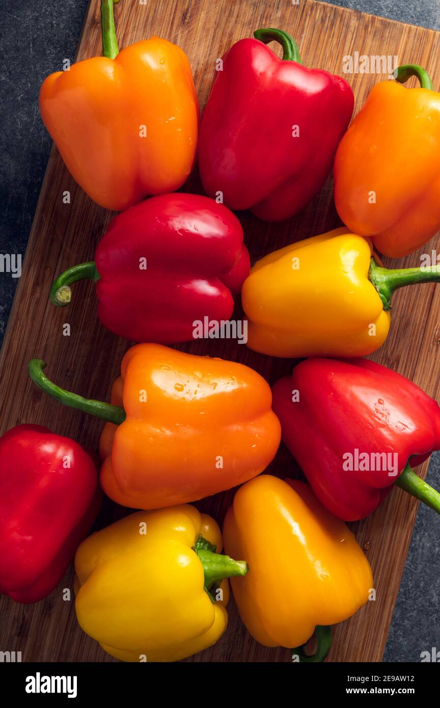 Orange, red and yellow bell peppers Stock Photo - Alamy
