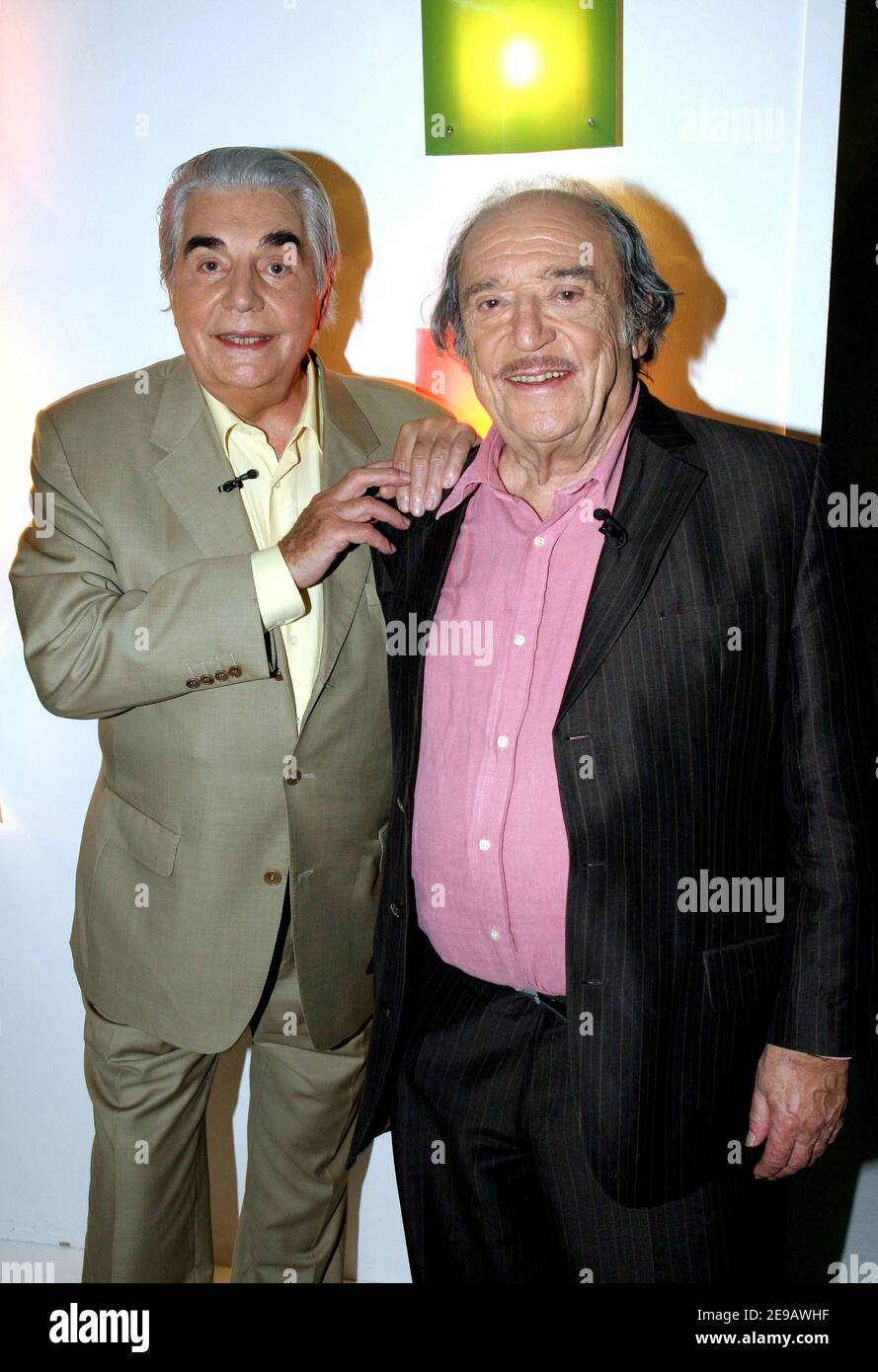 EXCLUSIVE. French humorists duo Roger Pierre (r) and Jean-Marc Thibault (l)  during the taping of 'TeleShopping' TV program at 'Plaine Saint Denis'  Studios near Paris, France on June 14, 2006. Photo by