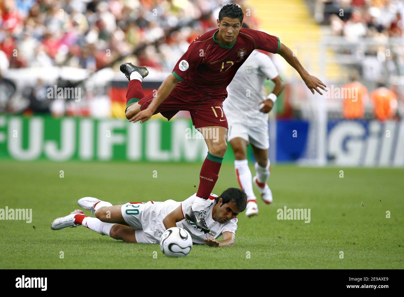 Portugal's Cristiano Ronaldo and Iran's Mohammad Nosrati battle for the ball during the World Cup 2006, Portugal vs Iran at the Fifa World Cup Stadium in Frankfurt, Germany on June 17, 2006. Portugal won 2-0. Photo by Christian Liewig/ABACAPRESS.COM Stock Photo