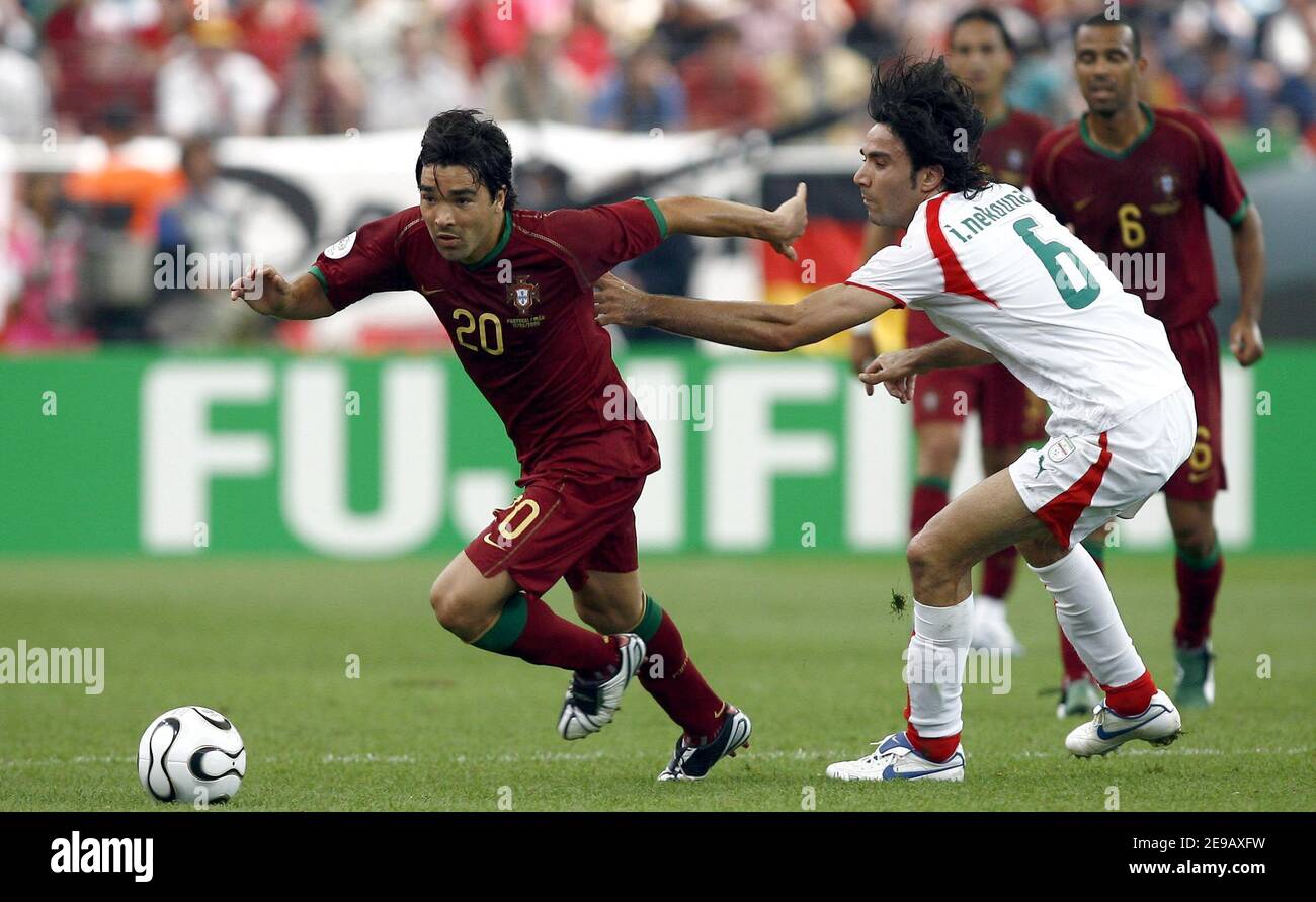 Portugal's Deco an dIran's Javad Nekounam battle for the ball during the World Cup 2006, Portugal vs Iran at the Fifa World Cup Stadium in Frankfurt, Germany on June 17, 2006. Portugal won 2-0. Photo by Christian Liewig/ABACAPRESS.COM Stock Photo