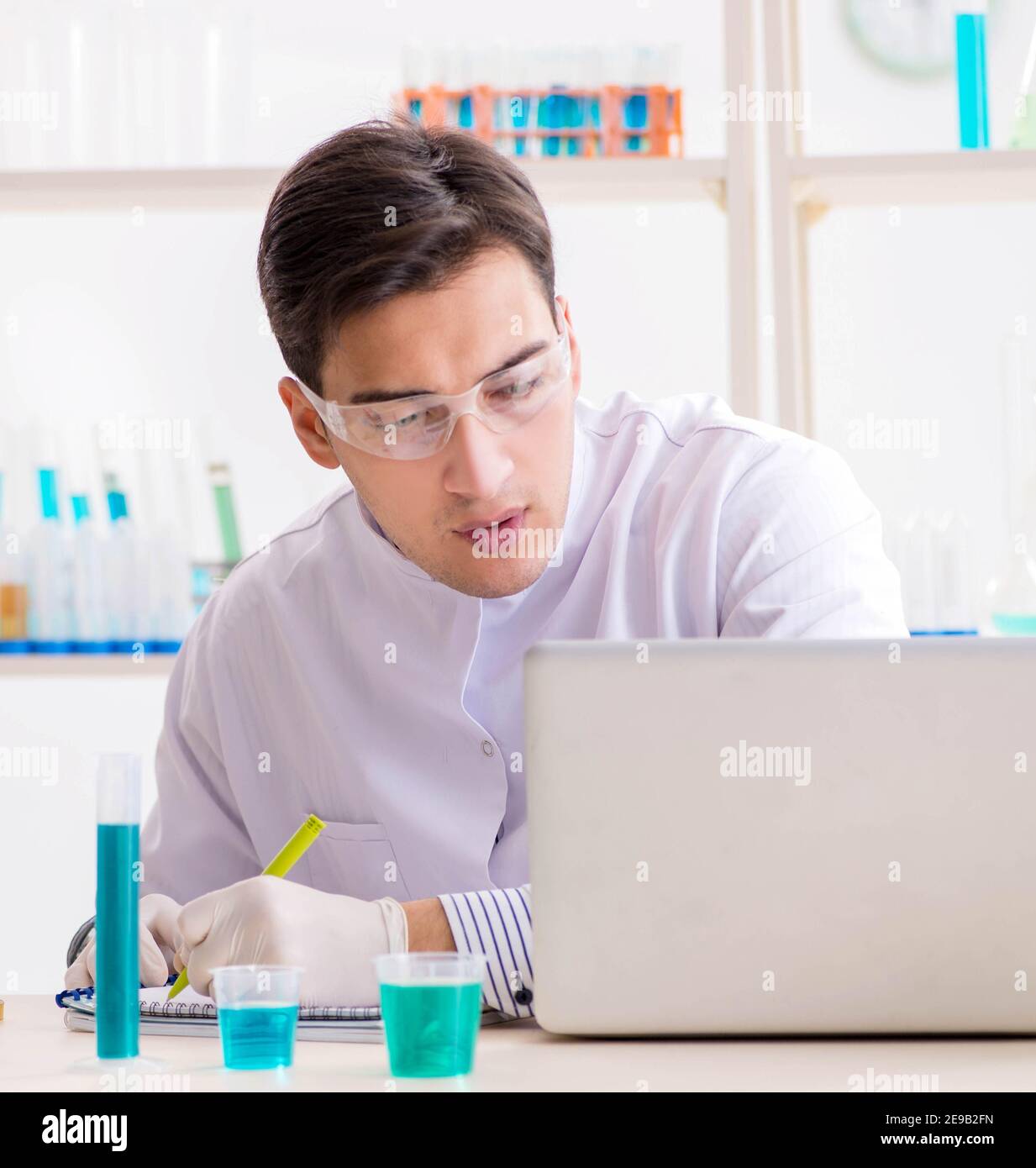 The man student working in chemical lab on experiment Stock Photo Alamy