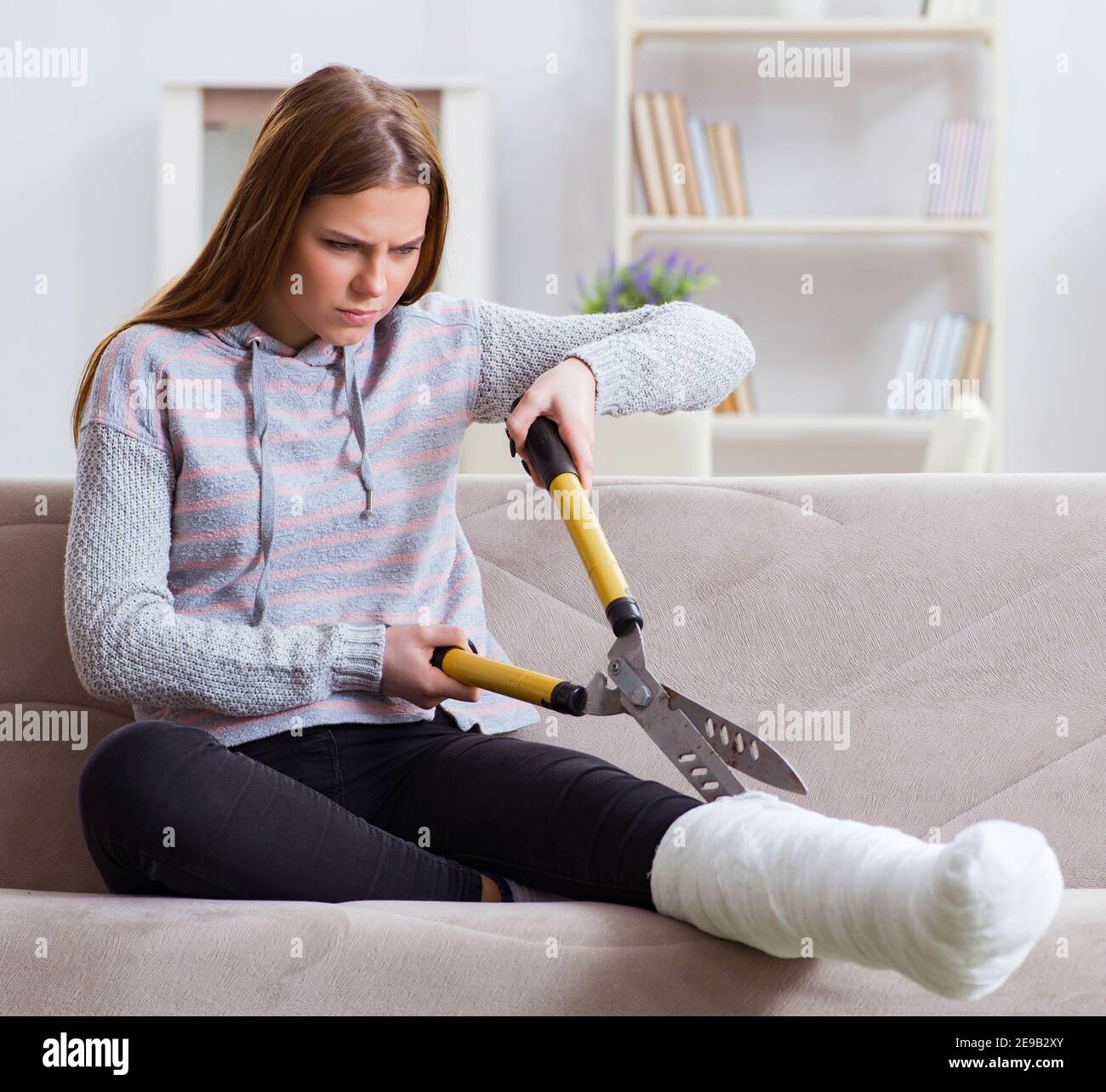 The young woman with broken leg at home Stock Photo Alamy