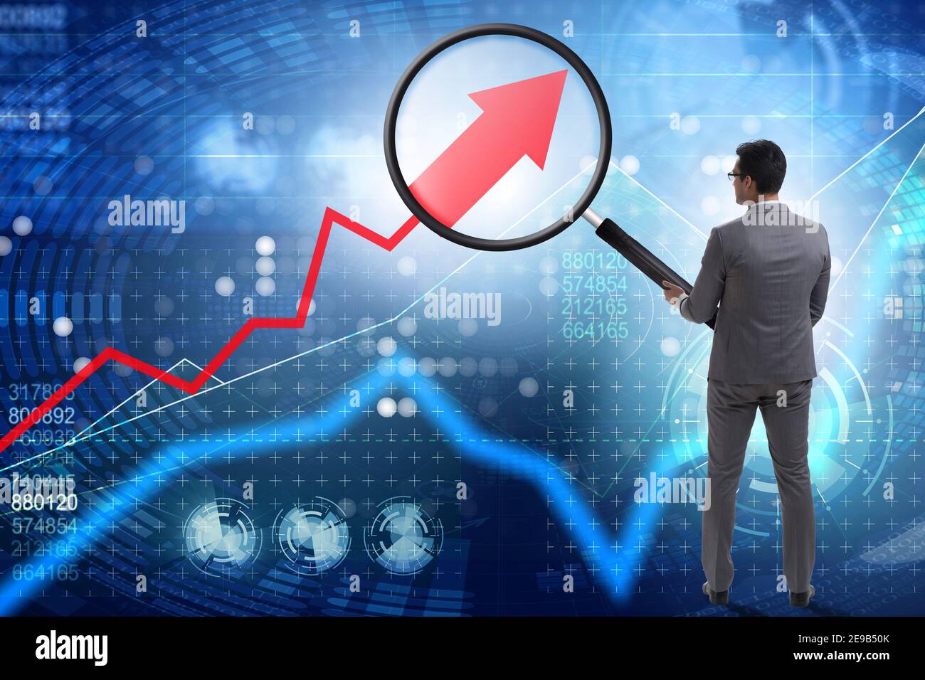 Concept of the economic growth with chart and magnifying glass Stock