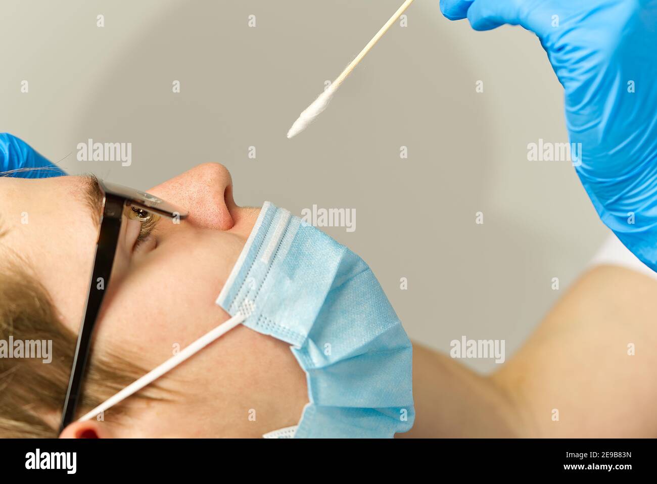 Pediatrician or doctor taking nasal mucus test, covid - 19 test . covid virus testing procedure concept Stock Photo
