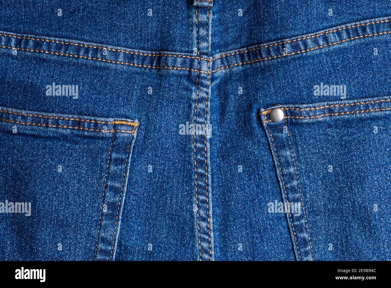 jeans pockets. blue jeans macro texture background. Stock Photo