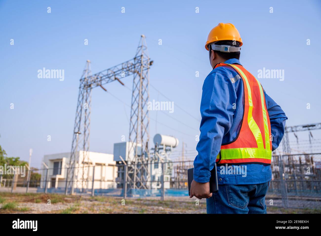 electric engineer check the transmission station Stock Photo Alamy
