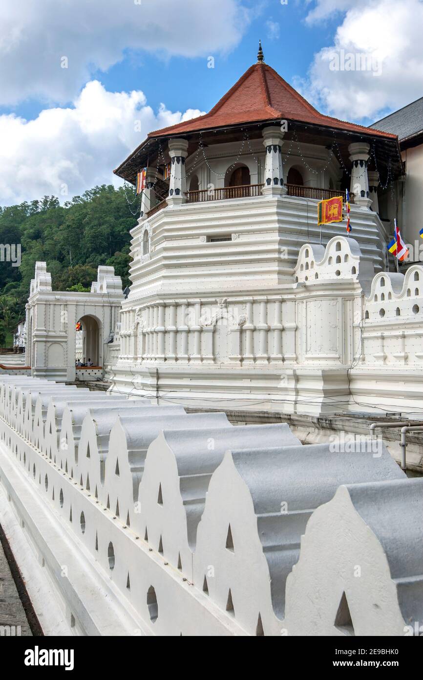 The Octagon Tower in the foreground and the Maha Vahalkada at the entrance to the Buddhist Temple of the Sacred Tooth Relic at Kandy in Sri Lanka. Stock Photo
