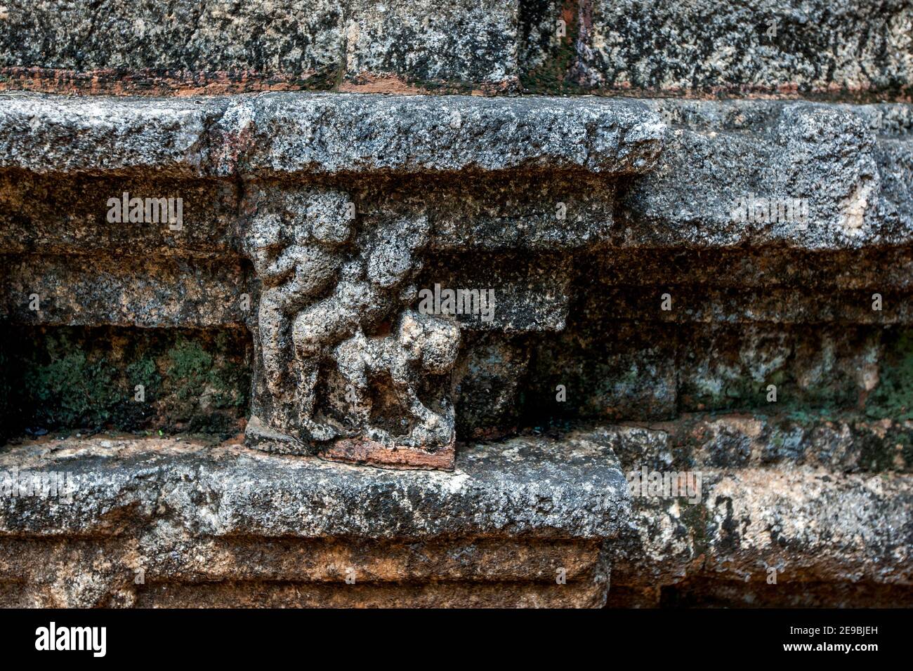 A stone carving depicting Kamasuthera on the Buddhist image house (gedige) at Nalanda Gedige near Matale, Sri Lanka. Stock Photo