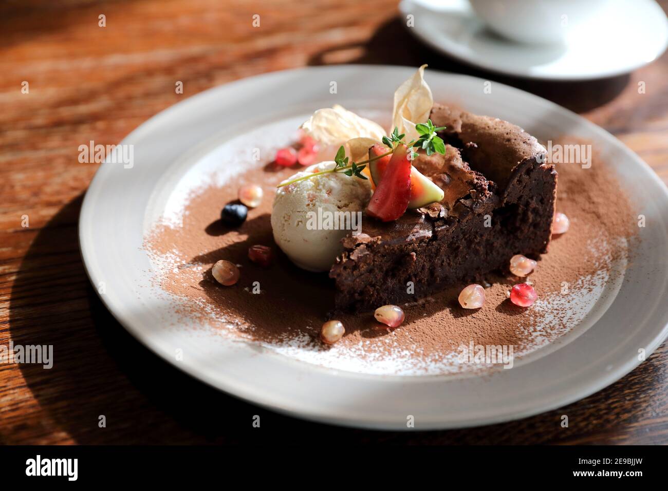 Chocolate cake with ice cream and coffee dessert on wood table Stock