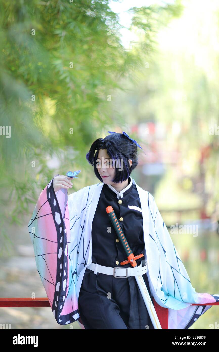 Japan anime cosplay portrait of girl with comic costume with japanese theme garden Stock Photo