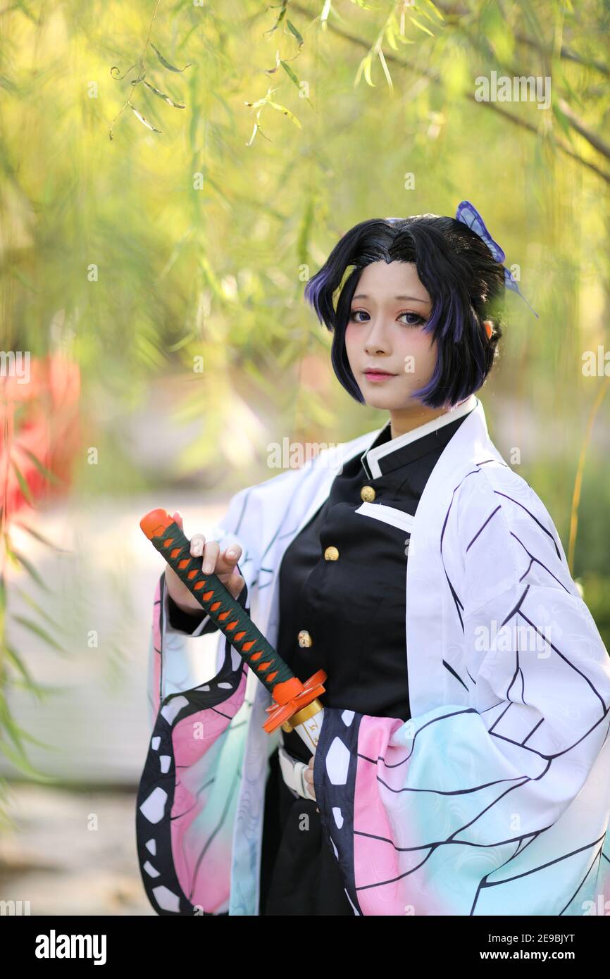 Japan anime cosplay portrait of girl with comic costume with japanese theme garden Stock Photo