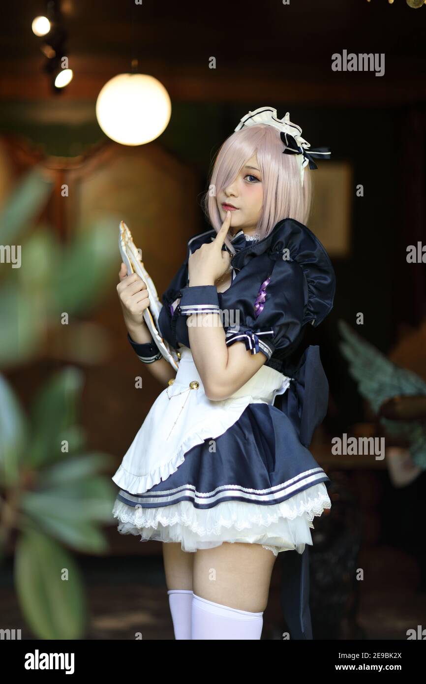 Japan anime cosplay portrait of girl with comic maid costume Stock Photo