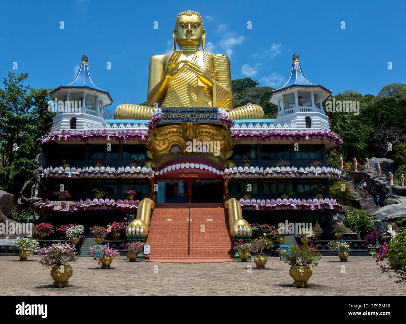 The Golden Temple which features a 30 metre high seated Buddha statue at Dambulla in Sri Lanka. The statue is designed in the dhammachakka mudra. Stock Photo