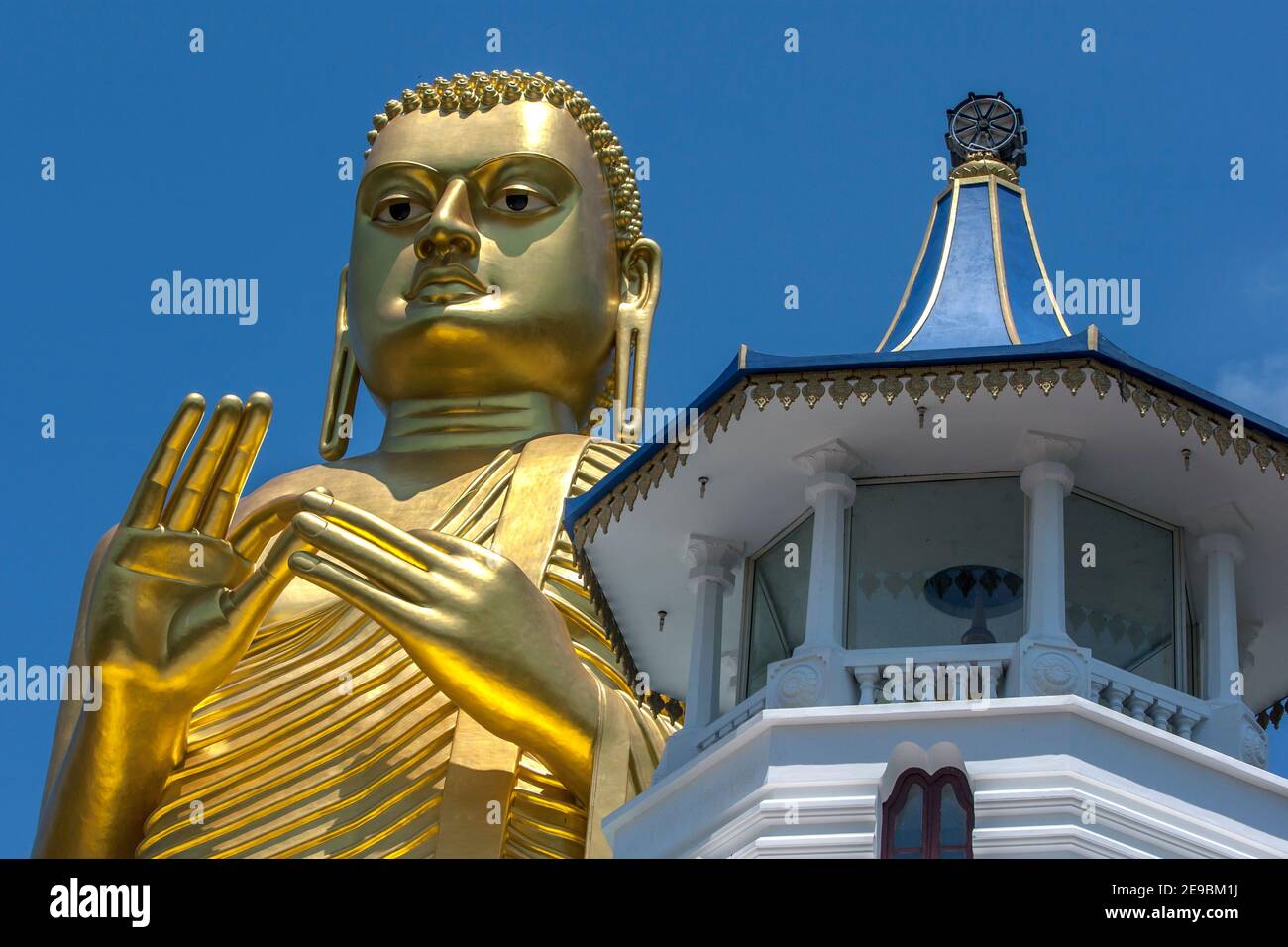 The head of the giant 30 metre high golden statue of Buddha at the Golden Temple in Dambulla in central Sri Lanka. Stock Photo