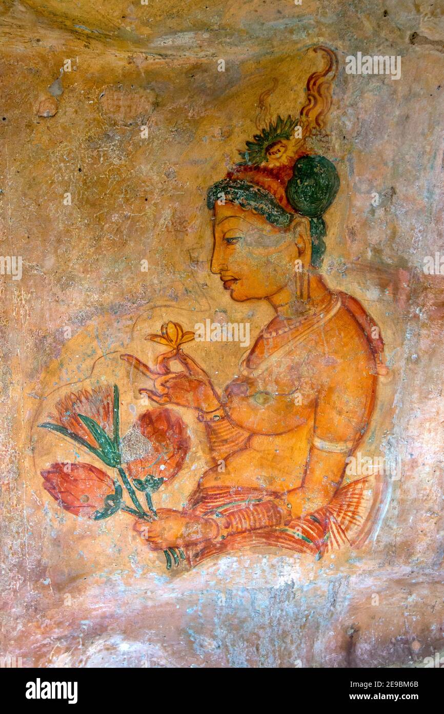 One of the beautiful frescoes of a woman at Sigiriya Rock Fortress at Sigiriya in Sri Lanka. The frescoes date from around the 5th century. Stock Photo