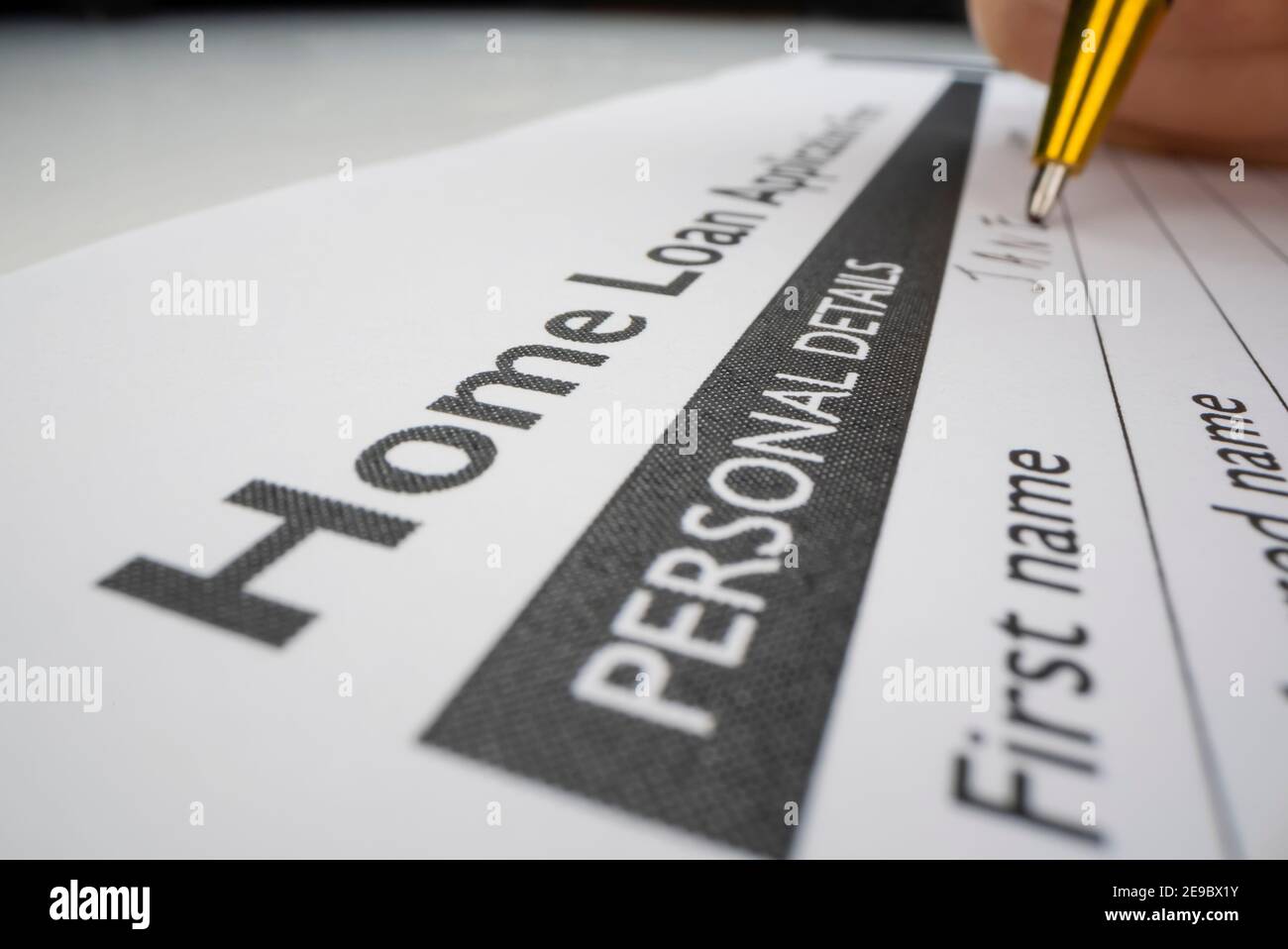 Completing home loan application form Stock Photo