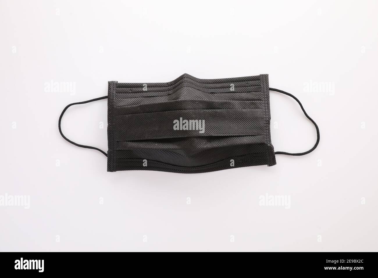 Used black mask isolated in white background Stock Photo - Alamy